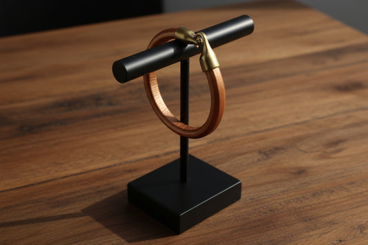 Hand-made men's bronze Regaliz leather bracelet on black stand-mousses greek art.